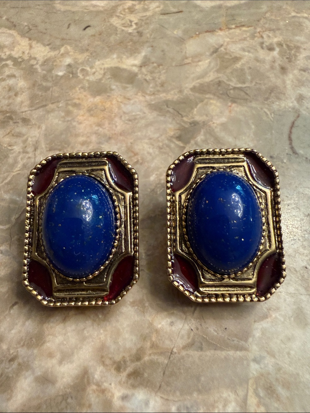 Vintage 1928 brand gold tone clip earrings with enamel and oval lapis stone